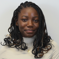 A headshot-style photograph of Sheena Nnam