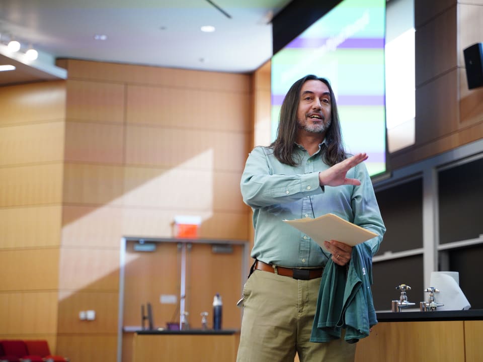 Dean Miguel Mostafa speaking at OwlHacks 2024