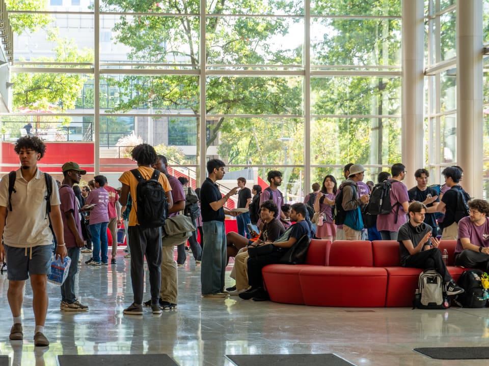 Participants gathering in the Atrium for coffee and snacks at OwlHacks 2025