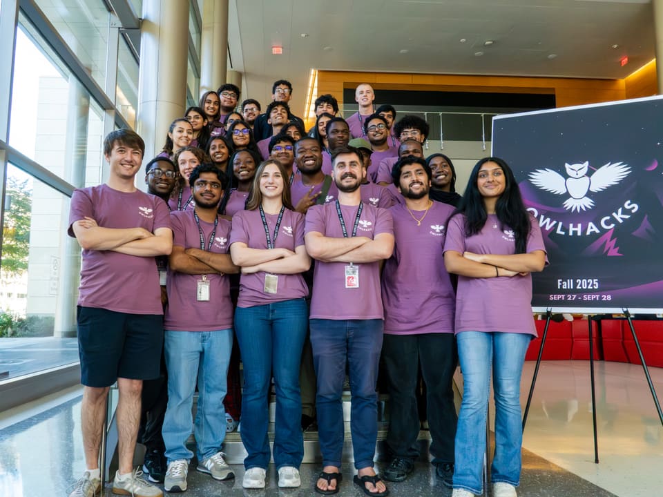 Professor Stephen MacNeil standing with the 2025 OwlHacks organizing committee