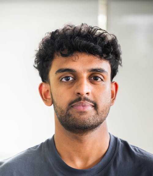 A headshot-style photograph of Alphin Shajan