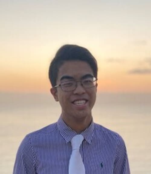 A headshot-style photograph of Alexander Yu