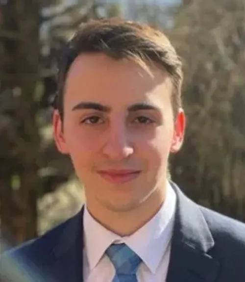 A headshot-style photograph of Dan Mogil