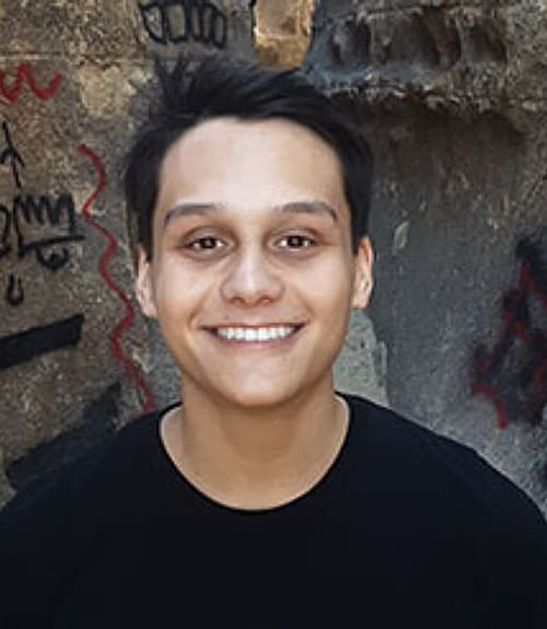 A headshot-style photograph of Enrique Arcilla