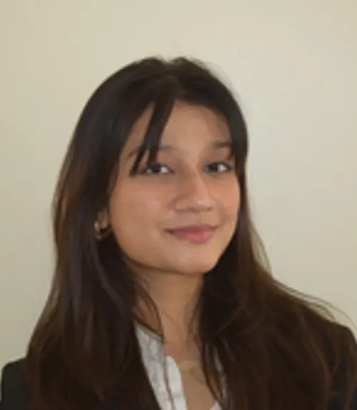 A headshot-style photograph of Hena Patel