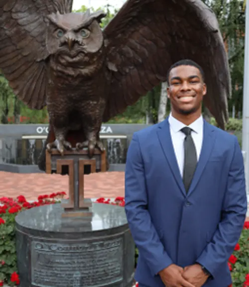 A headshot-style photograph of Jalen Friday