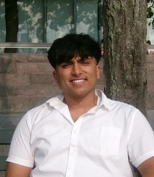 A headshot-style photograph of Kush Patel