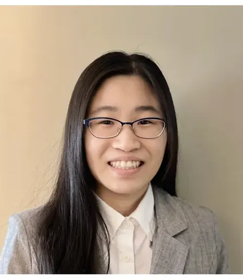 A headshot-style photograph of Lauren Kan