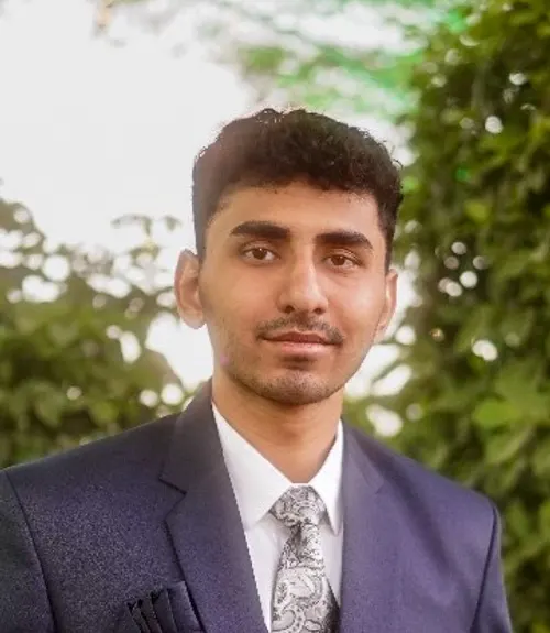 A headshot-style photograph of Manan Patel