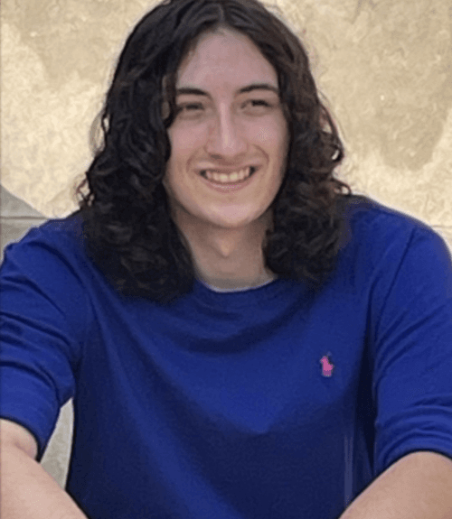 A headshot-style photograph of Sam Reedy