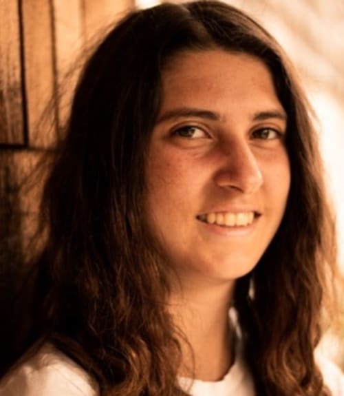 A headshot-style photograph of Sydney Kimbell