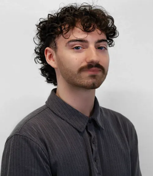 A headshot-style photograph of Trevor Flick