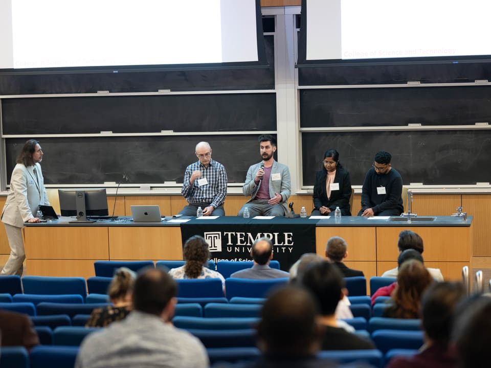 Answering questions on a panel.