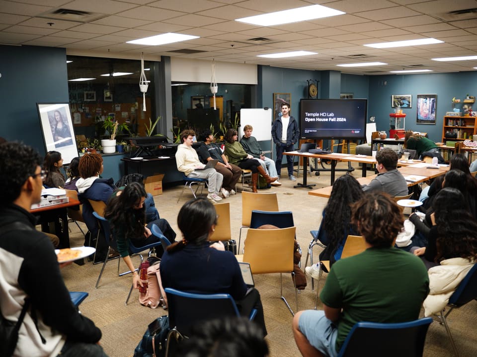 Professor MacNeil speaking at a Temple open house event.