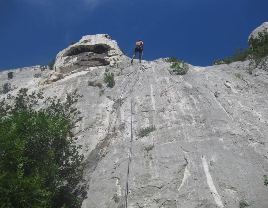 Professor Stephen MacNeil rock climbing in Cassis