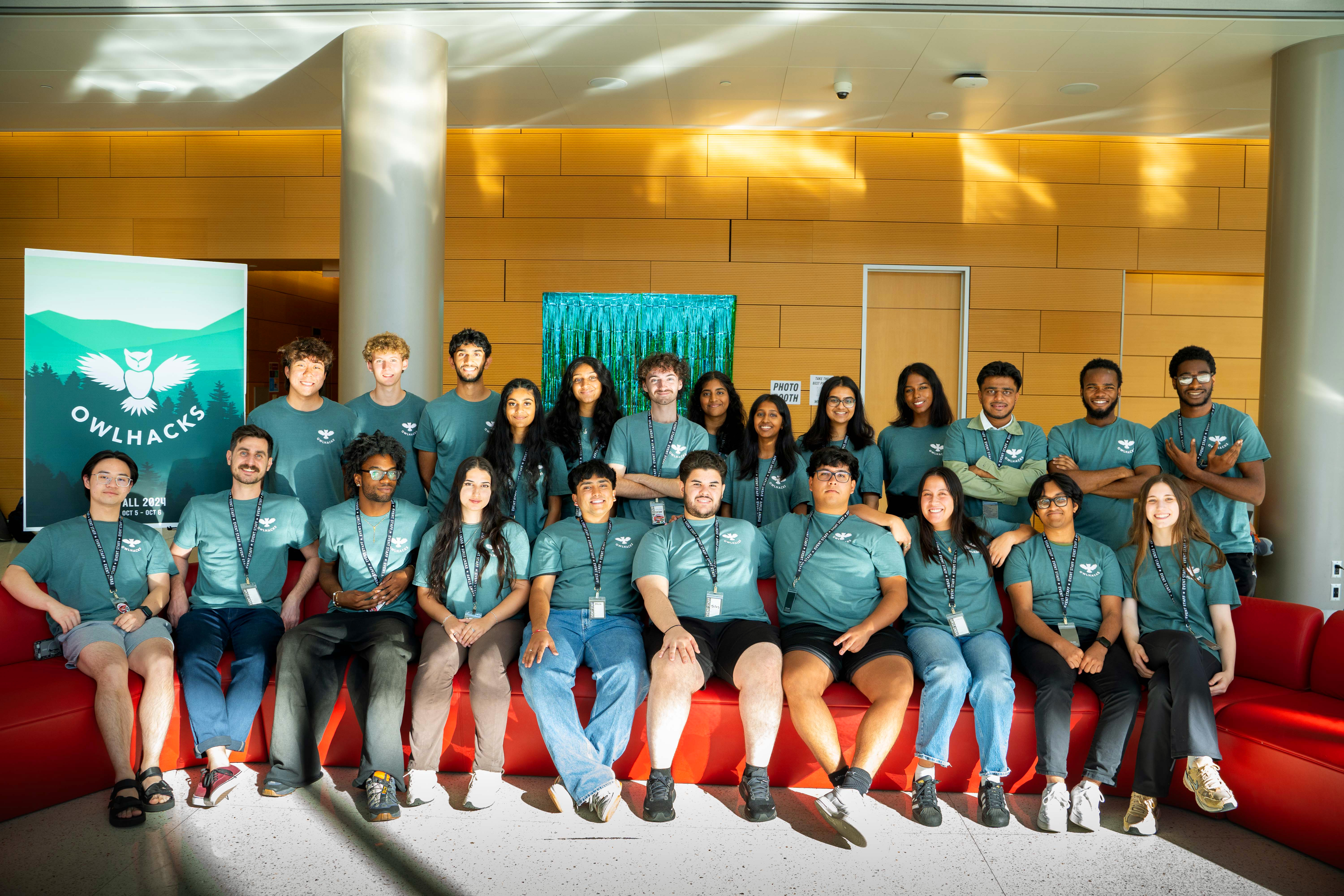 The 2024 OwlHacks organizing committee seated with Faculty Advisor Professor Stephen MacNeil