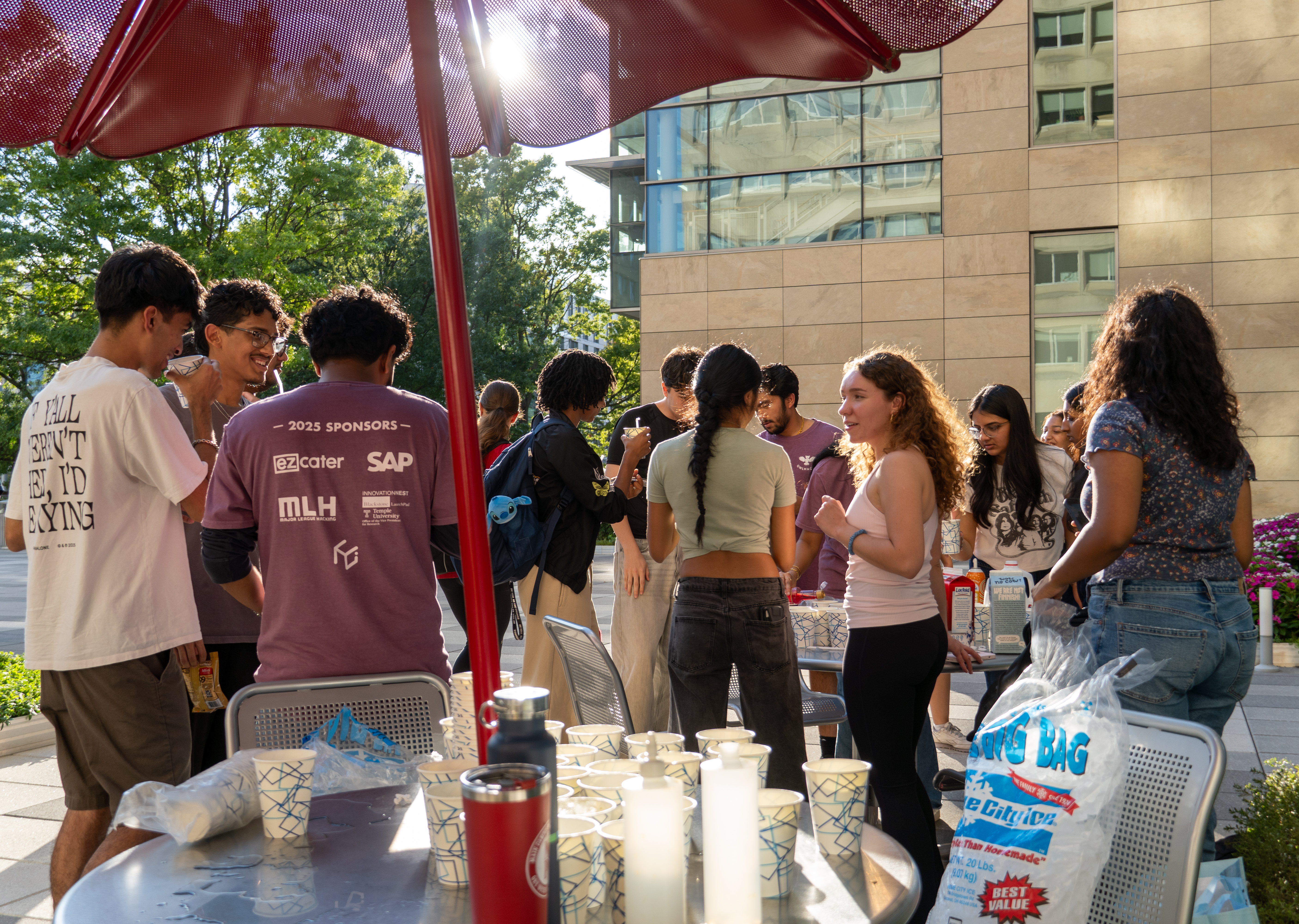 Hackathon attendees networking on the terrace