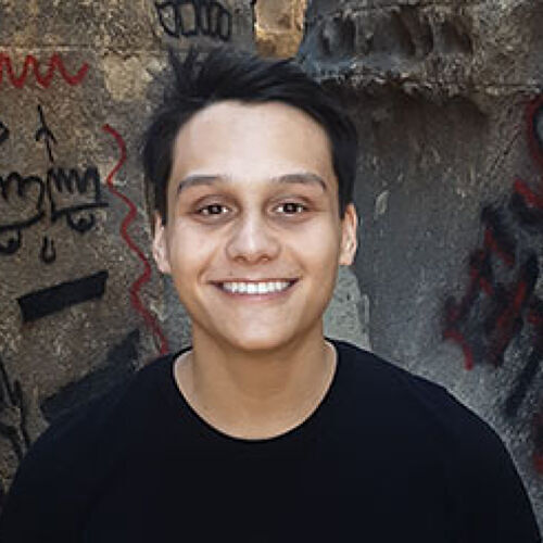 A headshot-style photograph of Enrique Arcilla